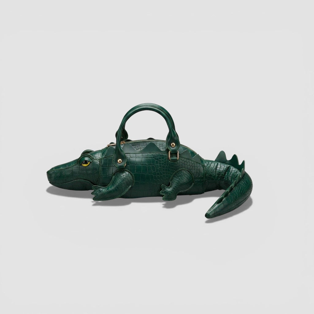 Green alligator-shaped handbag on a light gray background