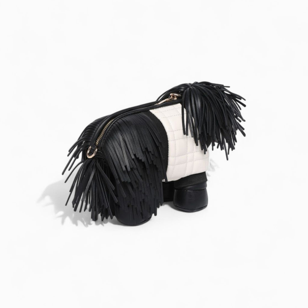Black and white handbag with fringe details on a white background