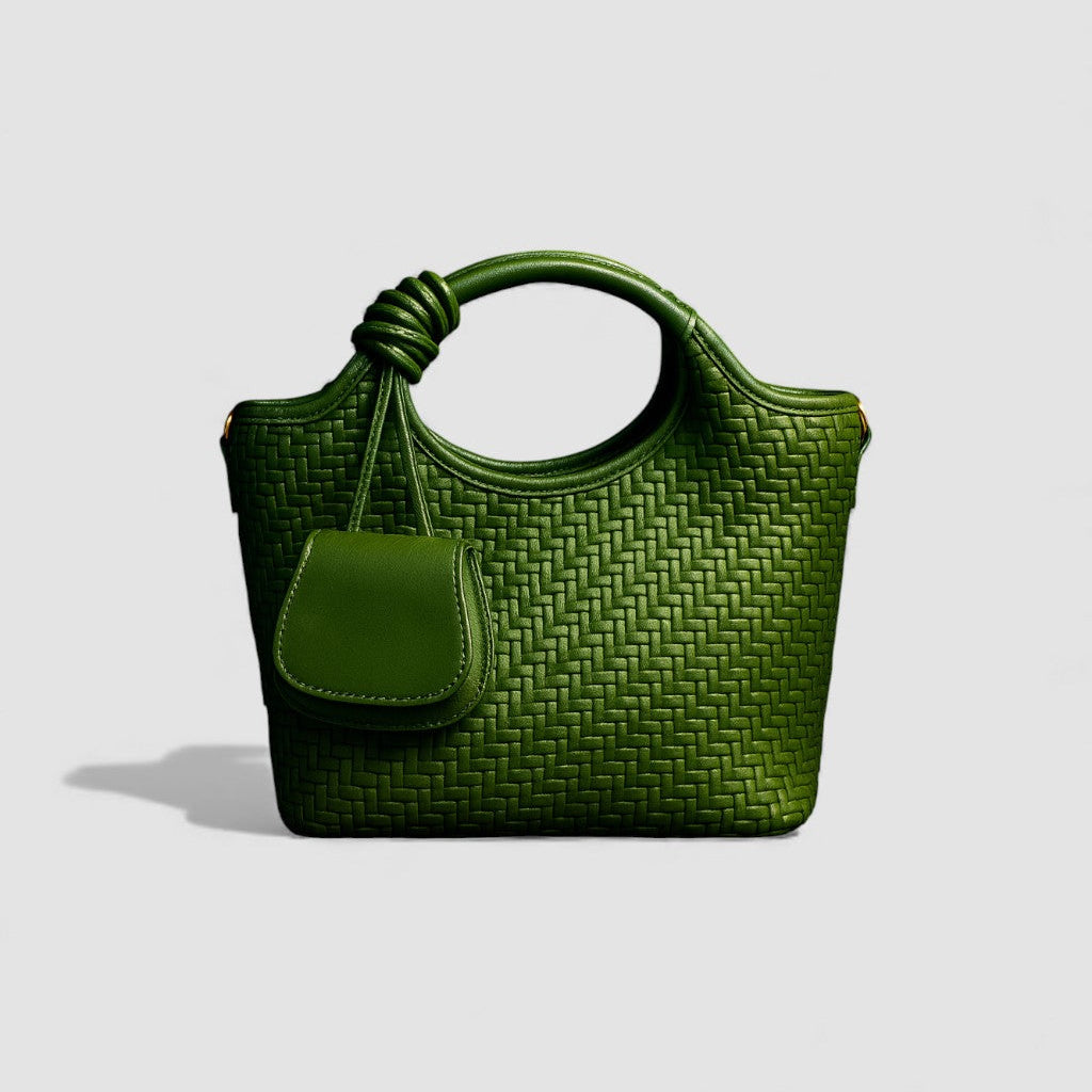Green woven handbag on a light gray background