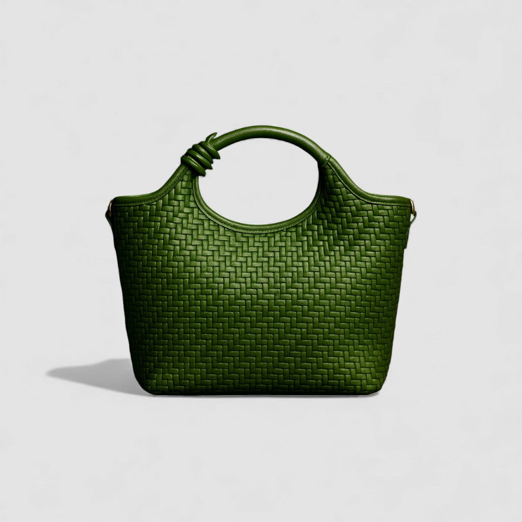 Green woven handbag on a light gray background