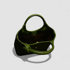 Green handbag on a light gray background